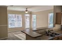 Bright living room with large windows and neutral carpet and paint at 5000 Culbreath Key Way # 1-220, Tampa, FL 33611