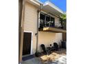 Inviting townhouse featuring a private balcony, front seating area, and well-manicured exterior at 5423 Sweetwater Terrace Cir, Tampa, FL 33634