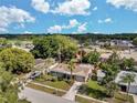 An aerial view showcases the single-story home's landscaping, roof and proximity to neighborhood amenities at 5936 13Th Ave, New Port Richey, FL 34652