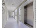 Well-maintained community hall with elevator access to units and freshly painted railings at 6826 Stones Throw N Cir # 11308, St Petersburg, FL 33710