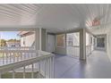 Hallway entrance to condos featuring painted railings and an exit sign for safety at 6826 Stones Throw N Cir # 11308, St Petersburg, FL 33710