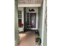 A welcoming front porch and charming decorations make this house a home at 8101 Roxboro Dr, Hudson, FL 34667