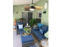 Relax on the cozy, screened patio featuring comfortable seating at 8101 Roxboro Dr, Hudson, FL 34667