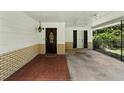 Covered carport with brick accents, offering convenient parking and shelter from the elements at 1116 W Kirby St, Tampa, FL 33604