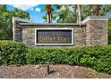 Stone monument sign with the community name 'Panther Trace' set against a backdrop of manicured greenery at 11309 Langworth Hill Ln, Riverview, FL 33579