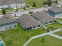 Aerial view of the home showing the backyard, patio, and surrounding neighborhood at 13105 Fruitville Way, Riverview, FL 33579