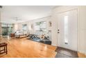 Bright living room features light colored hardwood floors and natural light at 2368 Flanders Way # D, Safety Harbor, FL 34695