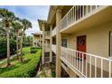 View of building's exterior highlighting multiple stories and private balconies at 2690 Coral Landings Blvd # 122, Palm Harbor, FL 34684