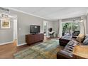 Living room featuring hardwood floors, balcony access, and ample natural light at 3325 Bayshore Blvd # A31, Tampa, FL 33629