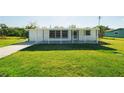 Single-story home exhibiting a well-kept lawn and inviting curb appeal at 3614 Vasco St, Punta Gorda, FL 33950