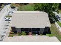 Aerial view featuring the building's roof, parking, and landscaping, showcasing its overall design at 4015 My Lady Ln # 7, Land O Lakes, FL 34638