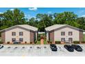 The building features a two-story apartment with parking and landscaping visible at 4015 My Lady Ln # 7, Land O Lakes, FL 34638