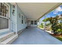 Spacious covered patio with room for seating, ideal for relaxing and enjoying the outdoors at 427 Pelican S Dr, Oldsmar, FL 34677