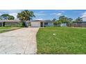 Charming single-story home with a well-manicured lawn and inviting curb appeal at 4518 Helena Ne St, St Petersburg, FL 33703