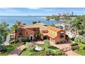 Beautiful Mediterranean home overlooking bay views with a lush circular driveway and garden at 501 Brightwaters Ne Blvd, St Petersburg, FL 33704