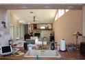 Open-concept kitchen overlooking the living room with stainless faucet and ceramic tile countertop at 5581 Greyston St, Palm Harbor, FL 34685