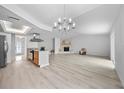 Bright open-concept living space with eat in kitchen, stone fireplace and lots of natural light at 6204 Walsh Ln, Tampa, FL 33625