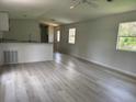 Bright and airy living room featuring durable flooring and modern finishes at 9053 Bourbon St, New Port Richey, FL 34654