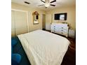 Bedroom featuring a comfortable bed, a dresser, wood floors, and ample natural light at 3135 33Rd N Ave, St Petersburg, FL 33713