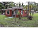 Quaint single-story house with a mailbox, and mature trees in the front yard at 1006 Gray St, Plant City, FL 33563