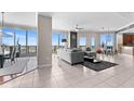 Bright and spacious living room with floor-to-ceiling windows and tile flooring at 1209 E Cumberland Ave # 2703, Tampa, FL 33602