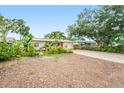 Quaint single-story home with a simple landscape and a brick-paved driveway at 1517 60Th S St, Gulfport, FL 33707