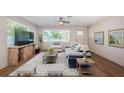 Bright living room featuring neutral colors, ceiling fan, modern furniture, and natural light at 1700 Shore Acres Ne Blvd, St Petersburg, FL 33703