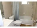 Functional bathroom with shower-tub, updated fixtures, and ample space at 208 Wilson Ave, Brooksville, FL 34601