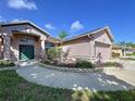 Attractive single-story home with well-kept lawn and landscaped garden at 22804 Willow Lakes Dr, Lutz, FL 33549