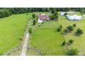 Expansive lot showcases a well-maintained home, ample space and tree coverage at 23075 Hayman Rd, Brooksville, FL 34602