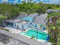 Aerial view of a home showcasing a private pool and spacious backyard at 2533 Blossom Lake Dr, Holiday, FL 34691