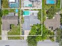 Aerial view of a home showcasing a private backyard with a swimming pool at 2533 Blossom Lake Dr, Holiday, FL 34691