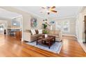 Bright living room with hardwood floors, a comfortable sofa, and large windows, creating a welcoming space at 304 21St N Ave, St Petersburg, FL 33704