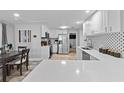 Modern kitchen featuring stainless steel appliances, white cabinets, and quartz countertops at 4460 67Th N St, St Petersburg, FL 33709