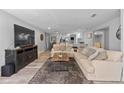 Spacious living room with open floor plan, comfortable seating, and plenty of natural light at 4460 67Th N St, St Petersburg, FL 33709