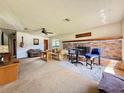 Inviting living room featuring a cozy fireplace and comfortable seating arrangements at 6285 52Nd N Ct, St Petersburg, FL 33709
