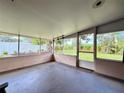 Enclosed screened porch providing a comfortable area for relaxing and enjoying the backyard view at 6285 52Nd N Ct, St Petersburg, FL 33709