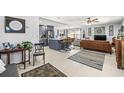 Open-concept living space with modern kitchen, stylish furniture, and neutral decor for versatile living at 1406 Nebraska Ave, Palm Harbor, FL 34683