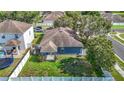 Aerial view of a well-maintained property with a lush green lawn and a fenced backyard at 18339 Fish Loop, Land O Lakes, FL 34638