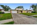 Charming home with a two-car garage and a well-manicured lawn at 1972 Lansing Dr, Clearwater, FL 33763