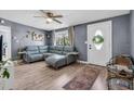 Cozy living room with a plush sofa, decorative rug, and ample natural light at 296 Huntington Dr, Largo, FL 33771