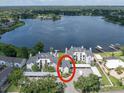 Stunning aerial view of lakefront townhomes featuring lush landscaping and boat docks at 3127 W Sligh Ave # 101C, Tampa, FL 33614