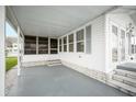 Enclosed porch area with multiple windows, providing natural light and outdoor views at 35045 Cynthia Ave # 35945, Zephyrhills, FL 33541