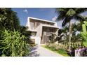 Striking angle view of a modern home featuring tropical landscaping and a winding drive way at 3611 Bayshore Ne Blvd, St Petersburg, FL 33703