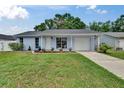 Charming single-story home with a well-manicured lawn, and beautiful landscaping at 3733 Mendocino St, New Port Richey, FL 34655