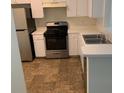 Bright kitchen featuring stainless steel appliances and updated counters and cabinets at 513 Summer Sails Dr, Valrico, FL 33594