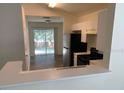 Bright kitchen featuring modern appliances and an open view to the patio through sliding glass doors at 513 Summer Sails Dr, Valrico, FL 33594