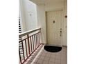 Apartment entryway featuring a secure front door and balcony with views at 7893 Sailboat Key S Blvd # 304, South Pasadena, FL 33707