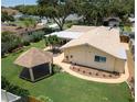 Aerial view of the home, gazebo and yard, showcasing the roof and landscaping at 9951 121St St, Seminole, FL 33772