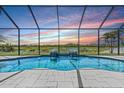 Breathtaking view from screened-in pool with serene water features at 12607 Pensacola Ct, Riverview, FL 33579